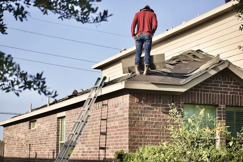 Professional roofer working on a residential roof in Volusia
